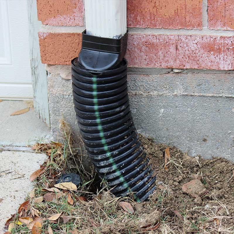 Gutter downspout extension redirecting water away from foundation