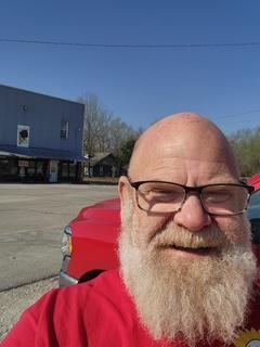 Original photograph: Scott Tetley, owner and lead inspector of TLC Land Crew, smiling outside in front of his red truck in Nixa, Missouri