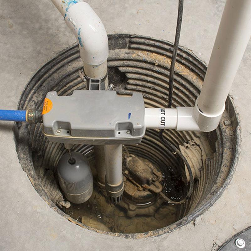 Properly installed sump pump in a concrete pit